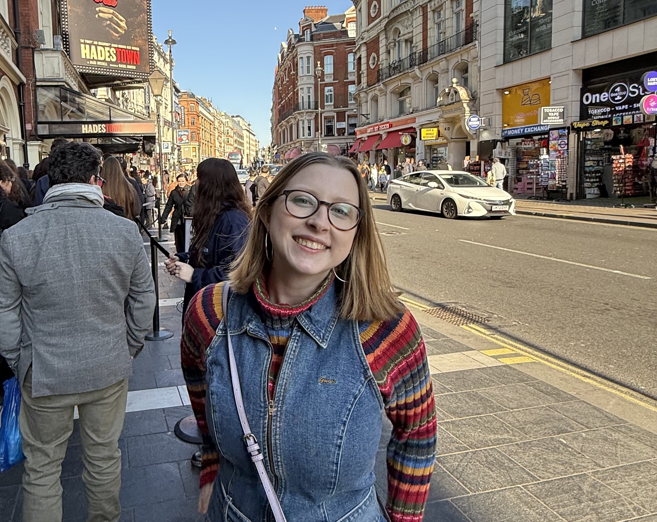 Abbey standing next to a busy street smiling
